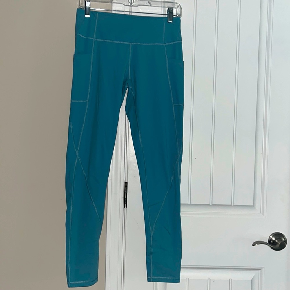 Women’s high waisted blue full length leggings with pockets